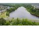 Aerial view of the pond and wooded area, offering a peaceful natural setting at 2855 Wilkes Lake Dr, Fuquay Varina, NC 27526