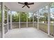 Relaxing screened porch with a ceiling fan, offering a comfortable outdoor living space at 2855 Wilkes Lake Dr, Fuquay Varina, NC 27526