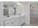 Bright bathroom features a double vanity and a view of the bedroom and glass shower at 293 Gregory Village Dr, Lillington, NC 27546