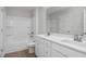 Bathroom featuring double sinks, white cabinets, and a shower-tub combo at 293 Gregory Village Dr, Lillington, NC 27546