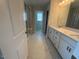 The bathroom boasts a double sink vanity, marble flooring, and a glass-enclosed shower at 293 Gregory Village Dr, Lillington, NC 27546