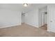 Carpeted bedroom features a ceiling light and easy access to other areas of the home at 293 Gregory Village Dr, Lillington, NC 27546