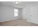 Neutral bedroom featuring carpet, natural light, and a minimalist style at 293 Gregory Village Dr, Lillington, NC 27546