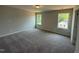 This large bedroom is complete with neutral carpeting, fresh paint, and lots of natural light at 293 Gregory Village Dr, Lillington, NC 27546