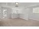 Spacious bonus room with neutral carpet and natural light; a versatile living area at 293 Gregory Village Dr, Lillington, NC 27546