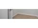 Walk-in closet featuring neutral carpet and white trim, offering ample storage space at 293 Gregory Village Dr, Lillington, NC 27546