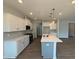 Spacious kitchen featuring stainless appliances, a large island, and plenty of storage at 293 Gregory Village Dr, Lillington, NC 27546