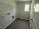 Laundry room features washer and dryer hookups, and built-in shelves to maximize storage at 293 Gregory Village Dr, Lillington, NC 27546