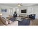Spacious living room with ample seating and plenty of natural light at 293 Gregory Village Dr, Lillington, NC 27546