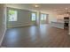 Open-concept living room with lots of natural light and hardwood flooring at 293 Gregory Village Dr, Lillington, NC 27546