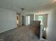 This open loft area features neutral carpeting, fresh paint, and natural light from a large window at 293 Gregory Village Dr, Lillington, NC 27546