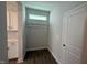 Practical mudroom area with hooks, and built-in storage for organization at 293 Gregory Village Dr, Lillington, NC 27546