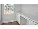 Office space featuring marble countertop, white cabinets, and a window at 293 Gregory Village Dr, Lillington, NC 27546