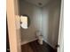 Modern powder room features an oval mirror and designer fixtures at 293 Gregory Village Dr, Lillington, NC 27546