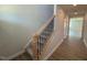Staircase featuring hardwood steps and a wood handrail at 293 Gregory Village Dr, Lillington, NC 27546