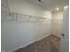 Spacious walk-in closet with rod and shelf system to maximize storage at 293 Gregory Village Dr, Lillington, NC 27546