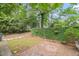 Private backyard with brick patio area provides space for relaxing and outdoor enjoyment at 3025 Wycliff Rd, Raleigh, NC 27607