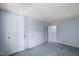 Cozy bedroom featuring plush carpeting and a spacious closet for convenient storage at 3025 Wycliff Rd, Raleigh, NC 27607