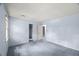 Spacious bedroom with multiple entryways, featuring light blue walls and a comfortable carpet at 3025 Wycliff Rd, Raleigh, NC 27607