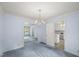 Charming dining room with blue walls and carpet, open to the adjacent kitchen at 3025 Wycliff Rd, Raleigh, NC 27607