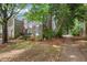A lovely townhouse with a blend of brick and siding, surrounded by lush greenery at 3025 Wycliff Rd, Raleigh, NC 27607