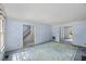 Bright living room featuring access to multiple doorways and windows at 3025 Wycliff Rd, Raleigh, NC 27607