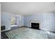 Spacious living room with a fireplace and open access to other rooms at 3025 Wycliff Rd, Raleigh, NC 27607