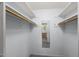 Functional walk-in closet with shelving and mirror, offering ample storage space for clothing and accessories at 3025 Wycliff Rd, Raleigh, NC 27607