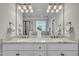 Bathroom showcasing a double vanity with granite countertops and decorative lighting at 3108 Lawson Walk Way, Rolesville, NC 27571