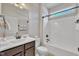 Well lit bathroom features updated vanity and shower with neutral walls and bronze fixtures at 3108 Lawson Walk Way, Rolesville, NC 27571