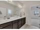 Bathroom with double vanity and large mirror, designed for comfort and style at 3108 Lawson Walk Way, Rolesville, NC 27571