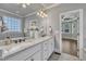 Bathroom vanity with granite countertops and decorative mirror at 3108 Lawson Walk Way, Rolesville, NC 27571