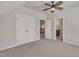 Bedroom with ceiling fan, adjoining bathroom, and access to other areas at 3108 Lawson Walk Way, Rolesville, NC 27571