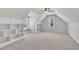 Large bedroom with carpet, built-in shelves and storage around the windows for ample space at 3108 Lawson Walk Way, Rolesville, NC 27571