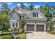 Beautiful two-story home with stone and siding, a two-car garage, and well-manicured landscaping at 3108 Lawson Walk Way, Rolesville, NC 27571
