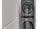 Modern laundry room with a stacked washer and dryer for convenience at 3108 Lawson Walk Way, Rolesville, NC 27571
