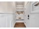 Mudroom entryway features board and batten, a built-in bench with storage below, and overhead coat hooks and shelving at 3108 Lawson Walk Way, Rolesville, NC 27571