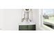 Bathroom featuring a modern vanity with sleek fixtures and ample lighting at 323 Beacon Dr, Pittsboro, NC 27312