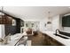 Open concept living space featuring a dining area, kitchen island, fireplace, and sitting area at 323 Beacon Dr, Pittsboro, NC 27312