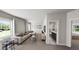 Bright living room featuring a comfortable sofa, a bathroom, and a bedroom at 323 Beacon Dr, Pittsboro, NC 27312