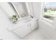 Light bathroom featuring a modern single sink vanity, white countertop, and tile floor at 335 Beacon Dr, Pittsboro, NC 27312