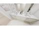 Elegant bathroom with a double sink vanity, white countertops, and sleek fixtures at 335 Beacon Dr, Pittsboro, NC 27312