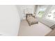Cozy bedroom featuring neutral carpet, bright windows, and comfortable decor at 335 Beacon Dr, Pittsboro, NC 27312