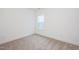 Clean, neutral bedroom with carpet and natural light from a single window at 335 Beacon Dr, Pittsboro, NC 27312