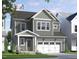 Charming two-story home with a covered porch, gray siding, white trim and a two car garage at 335 Beacon Dr, Pittsboro, NC 27312
