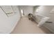 Upstairs hallway with carpet, a glass desk, and an abundance of natural light at 335 Beacon Dr, Pittsboro, NC 27312