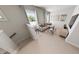 Upstairs living room with a comfortable sofa, neutral colored carpet and great natural light at 335 Beacon Dr, Pittsboro, NC 27312