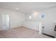 Bright upstairs loft area with carpet and natural light from two windows at 338 Beacon Dr, Pittsboro, NC 27312
