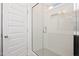 Modern bathroom showcasing a glass enclosed shower with tiled walls and floors at 338 Beacon Dr, Pittsboro, NC 27312