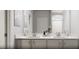 Elegant bathroom with a double sink vanity, modern fixtures, and a large mirror at 339 Beacon Dr, Pittsboro, NC 27312